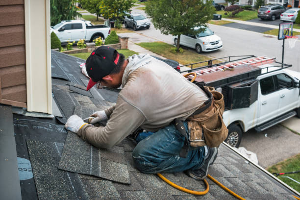 Professional Flat Roof Repair technician working in Leland, MI